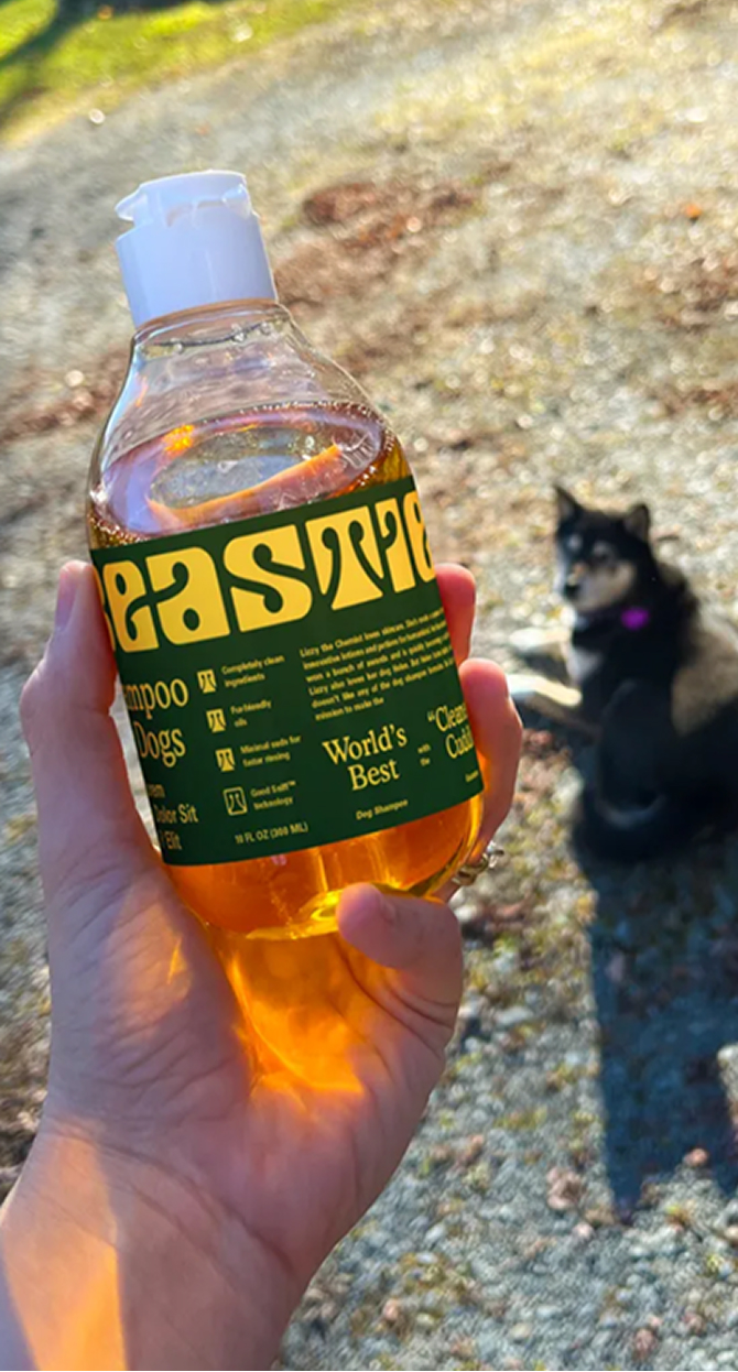 Beastie shampoo bottle held outdoors