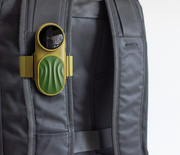 Owl device on backpack strap from side